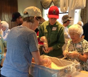 Stop Hunger Now volunteers Harriet Ross, Helen Schultz and Kris Lawyer