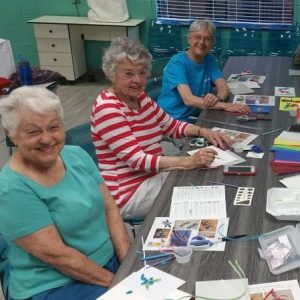Shirley, Ruth and Emily learning drawing techniques in Gretchen Phillip's class